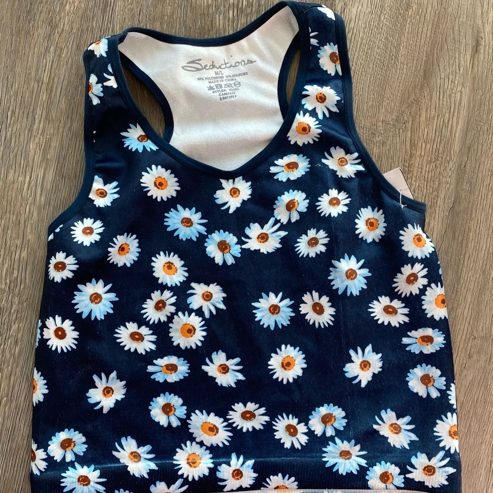 A crop top with daisy’s and flowers. - Picture 1 of 1
